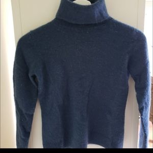 Reserved -- Blue turtleneck